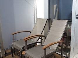 Deck chairs with footrests.