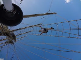 CLIMBING THE ROPE LADDER UP THE MAST...