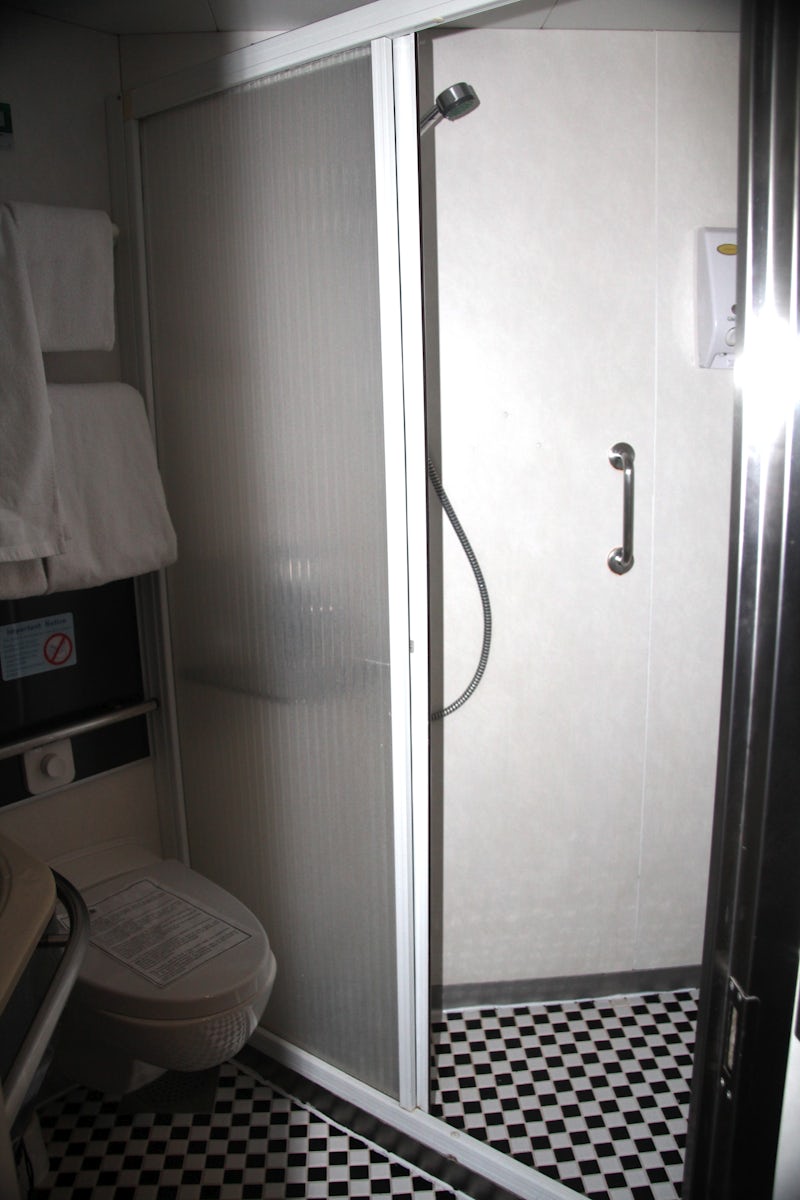 Shower with sliding door (hurray)  Loved this shower as opposed to the curtained showers in the small window rooms.