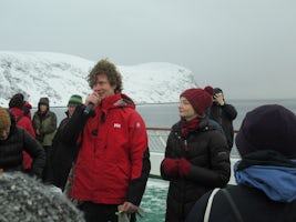 Frederick and Svenka from the Expedition team talking about the wild life and the reindeer that swim from their summer pastures to the mainland on deck.