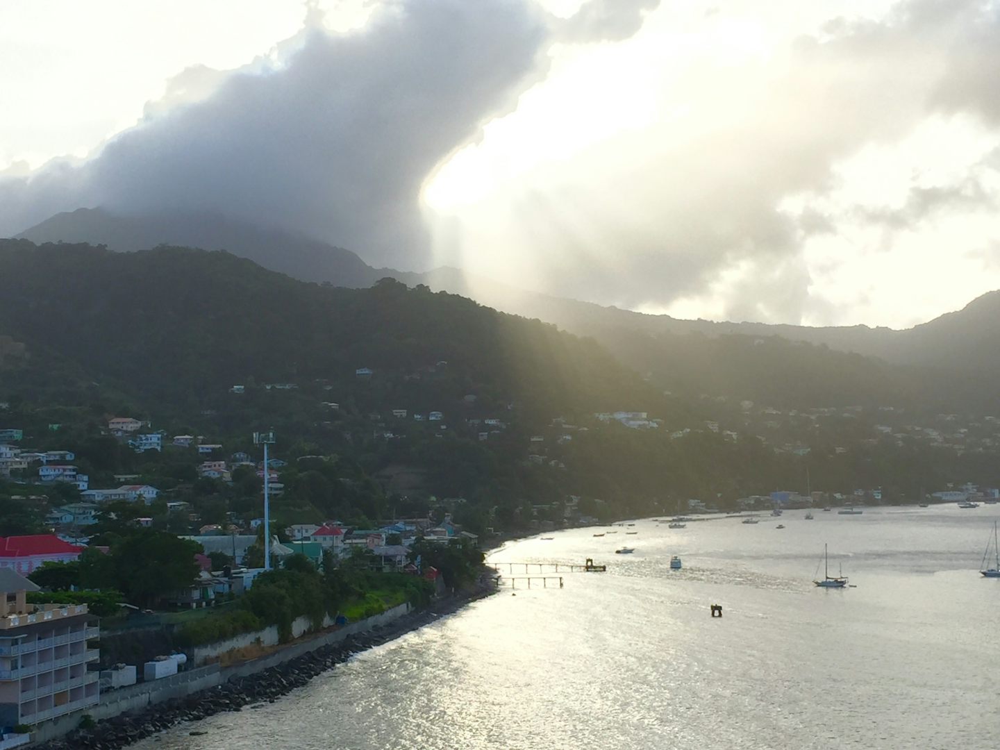 Sunrise over the mountain and through the clouds at St. Marteen