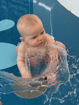 Playing in the splash pool