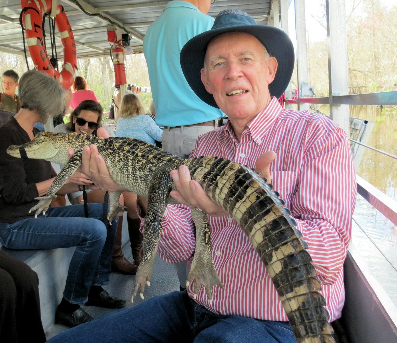 John holds an alligator