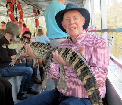 John holds an alligator
