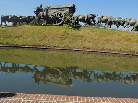 Memorial to settlers traveling by wagon across Brazil.  Note the reflection in the pond in front of the memorial.