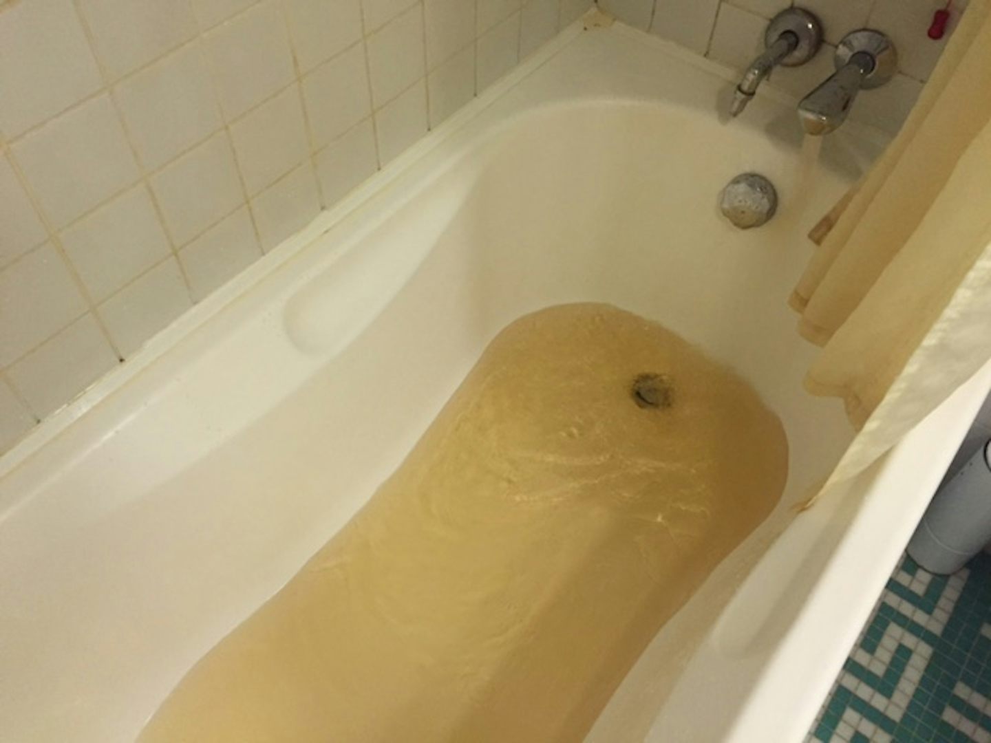 Our brown bath water coming out of the tap.