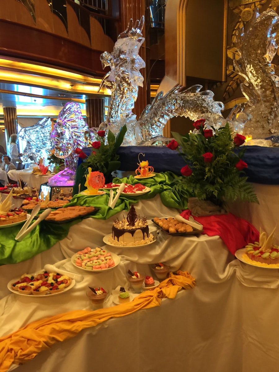 A special afternoon tea was one of the hits of the cruise
Beautiful ice carvings and treats from heaven were presented in a beautiful way in the britania resturant  Photo shows about  one fifth the size of the display