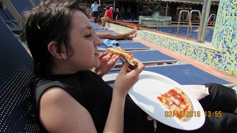 Eating Pizza by the pool