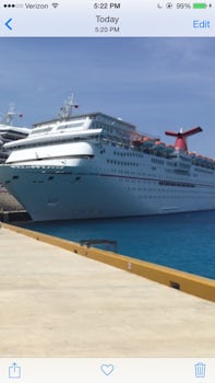 This just a picture of boat docked in Cozumel. I am a frequent cruiser. More than 10. This was just to be a nice long weekend. Oh my gosh. Boat was beyond filthy. Floors almost dark brown. Mold in showers.  ... Room steward very inattentive. Never once in dinning room did we get correct food we ordered. Dinner food cold. No bar service at dinner. I did not stay in an inexpensive room in the bowels of the boat either.  Food at buffet was so salty and fried food tasted of old grease. Fruit was not ripe. Ordering drinks at bar many tenders could not understand English well enough to get your drinks correct. This BOAT IS BEYOND DIRTY AND SHOULD BE PUT OUT OF COMMISSION!!!