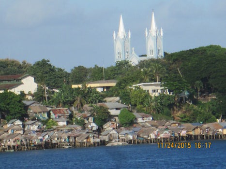 Local housing and the Immaculate Conception Cathedral in the background, Puerto Princesa, Palawan,Philippines.