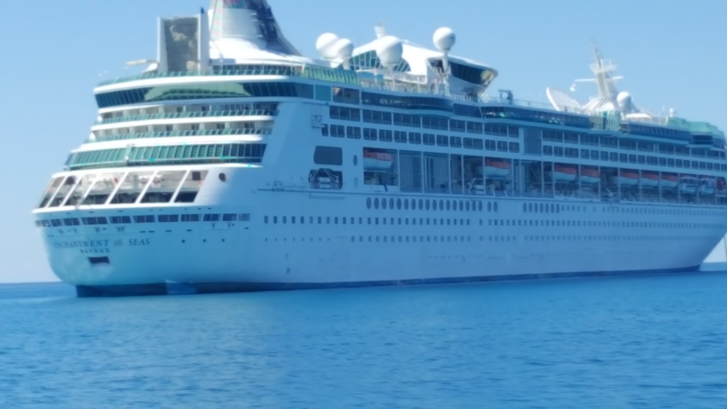 Picture of Enchantment of the Seas taking from ferry coming from Coco Cay