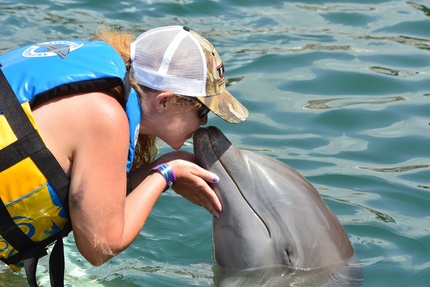 Kissing a dolphin in St Kitts.