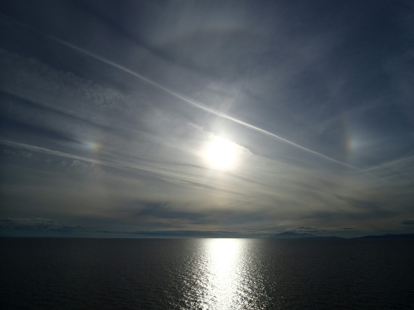 Sun devil and 22-degree halo leaving Vancouver.