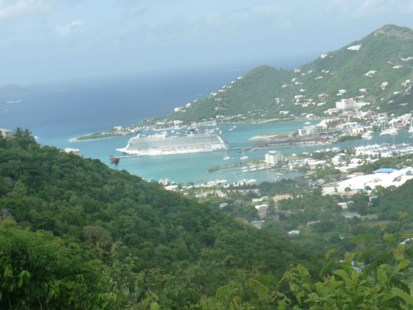 Photo of The Cruise Ship in Port, far away from the mountain top.