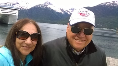 My wife and I with the Island Princess as the background at Skagway, Alaska