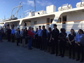 Entire crew saying goodbye until we meet again as we leave the ship