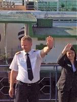 waving goodbye to captain and hotel manager
