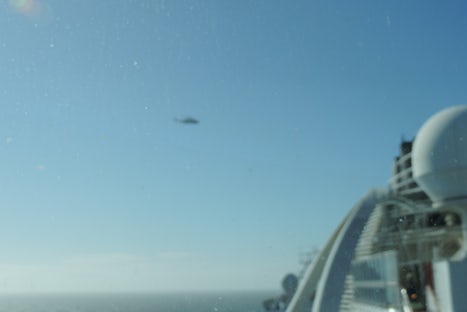 the Irish Coast Guard helicopter surveying our ship while we were broken down