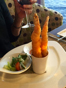 A shrimp tempura dish served with flair in the Tamarind specialty restauran