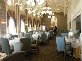 One side of the J. M. White Dining Room. Note oval, stained-glass windows a