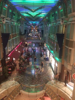 A picture, taken from the balcony, of the shopping boulevard on the ship.