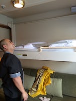 Our steward, Mervin - from the Philippines - showing us the bed that lowers