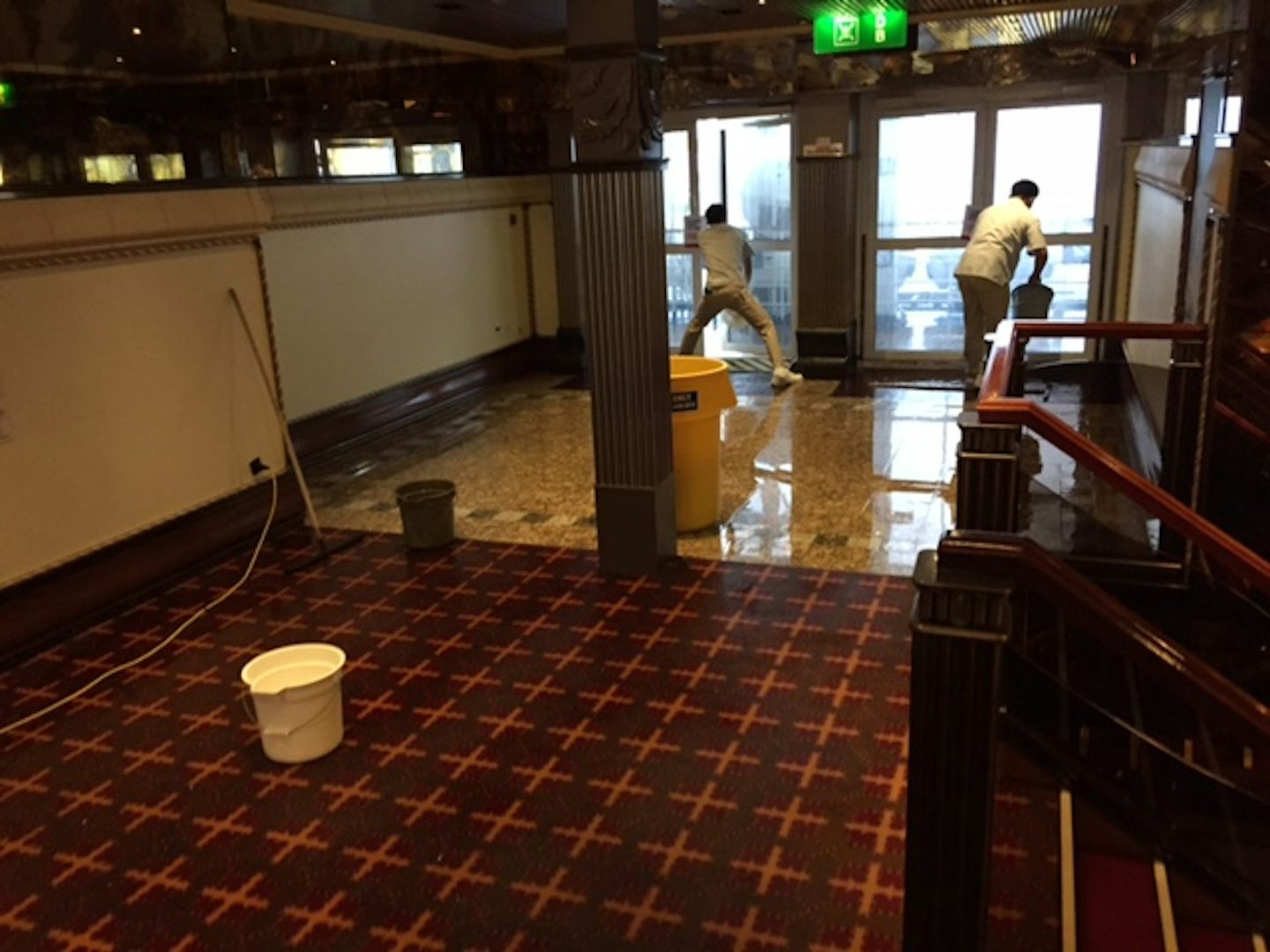crew cleaning up after waves flooded deck 3 by taj mahal.