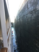 Side of the lock close to the ship as the lock empties to tak us downstream