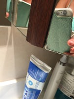 Cracked, chipped stateroom bathroom mirror.