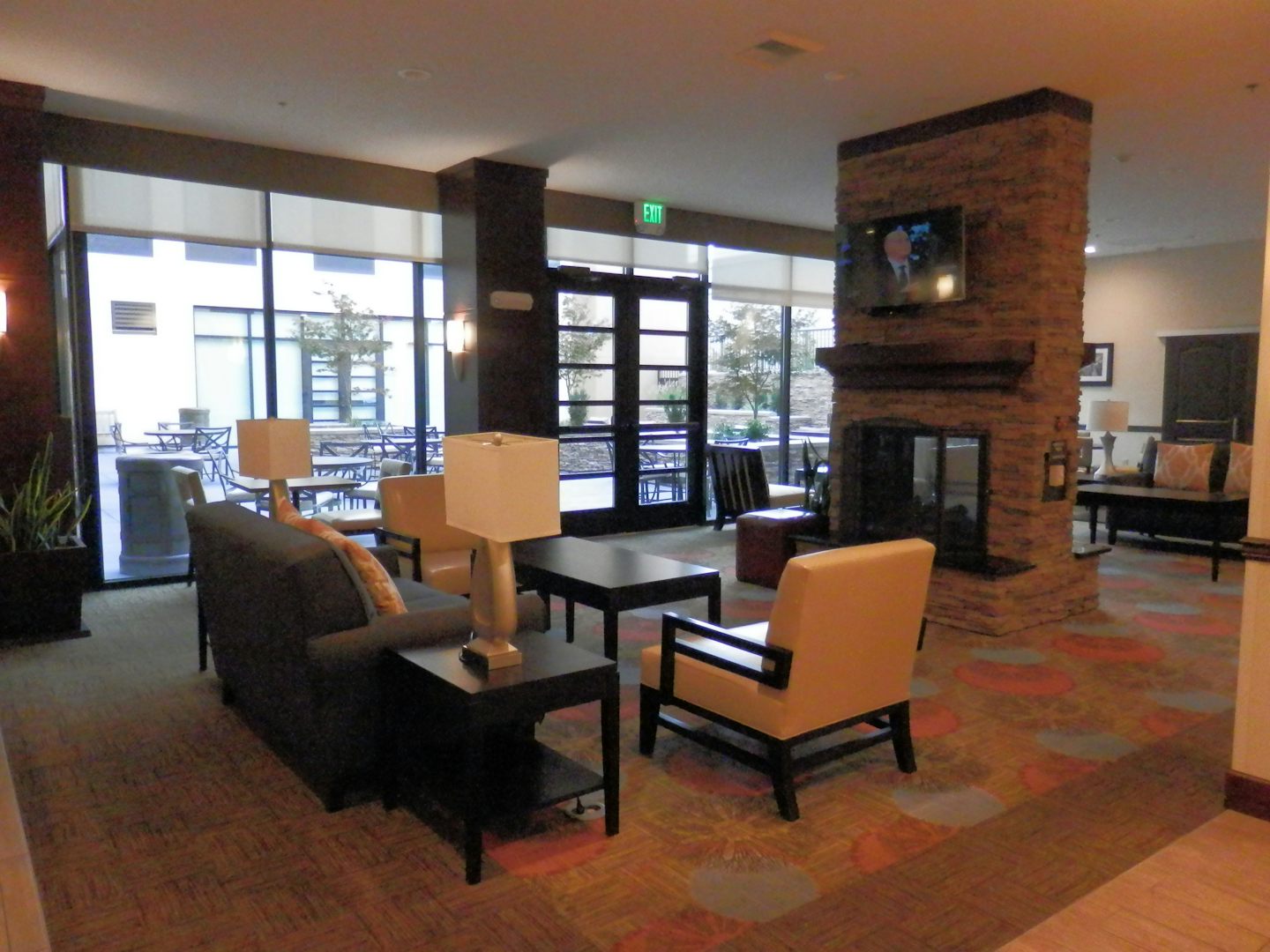 Staybridge suites living space with movie room in background