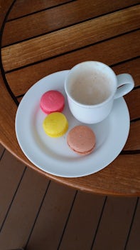 Macaroons and cappuccino on board.