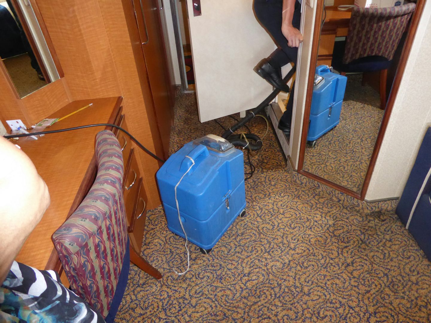 Drying the carpet.  Two days of intrusions into our stateroom.