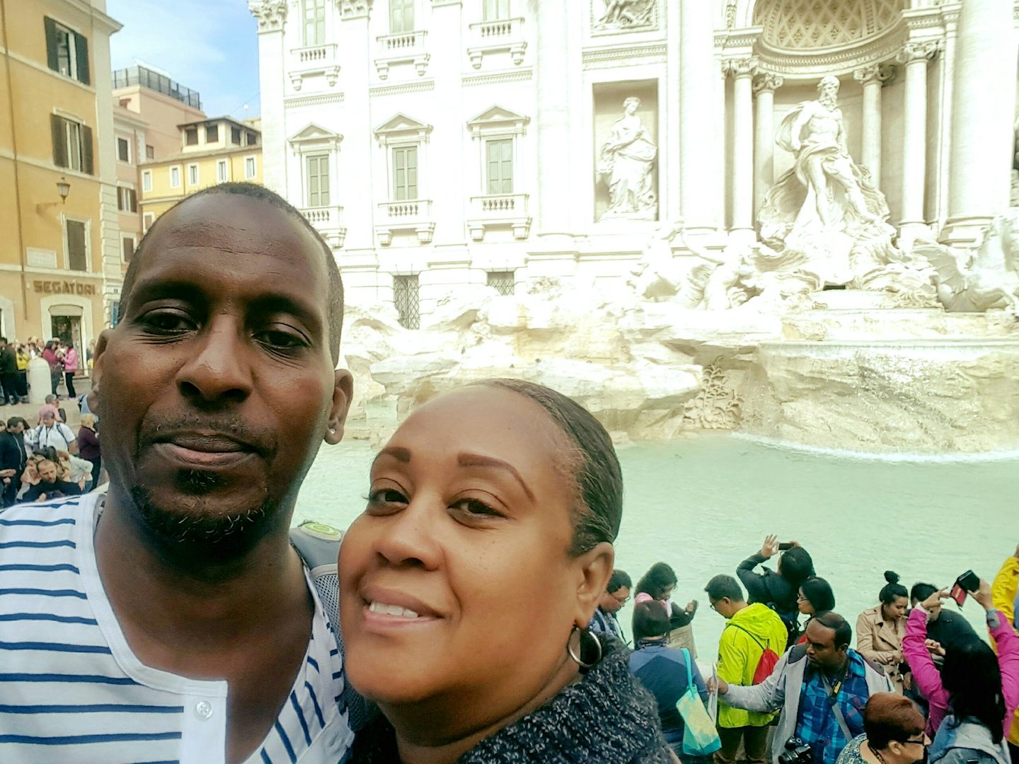 Hubby & I in front of the Trevi Fountain in Rome Italy on our tour.