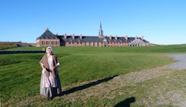 Arrival at fortified old city of Louisbourg, Nova Scotia, with people in pe