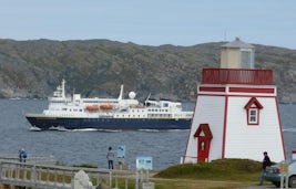 The Explorer enters the port of St. Anthony, Newfoundland, passing the ligh