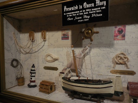 A displayed collection of maritime gifts received by Queen Mary herself add