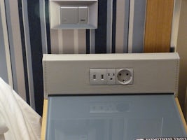 Bedside charging area with multi-plug capable outlets, there are more avail