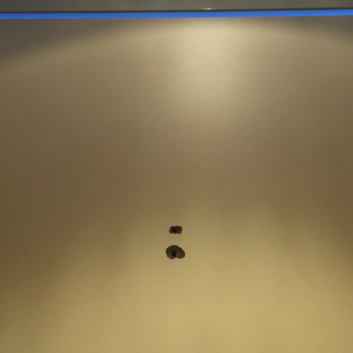 holes where hooks had been ripped off were common in the public restrooms