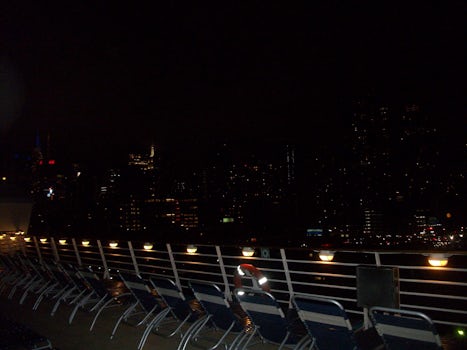 Sailing out of New York with city all lit up