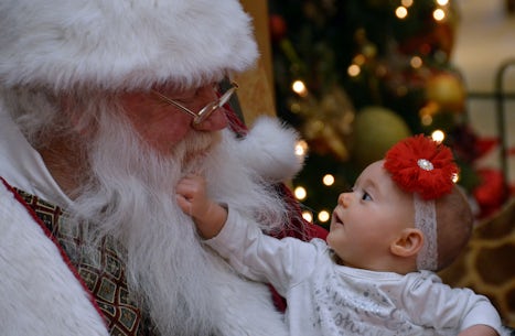 Natalie meets Santa for the first time.