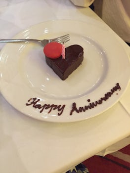 We celebrated our anniversary on the ship and our waiter brought us a cake!