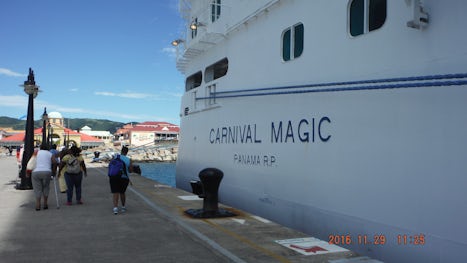 The side of the ship, parked up next to the dock.