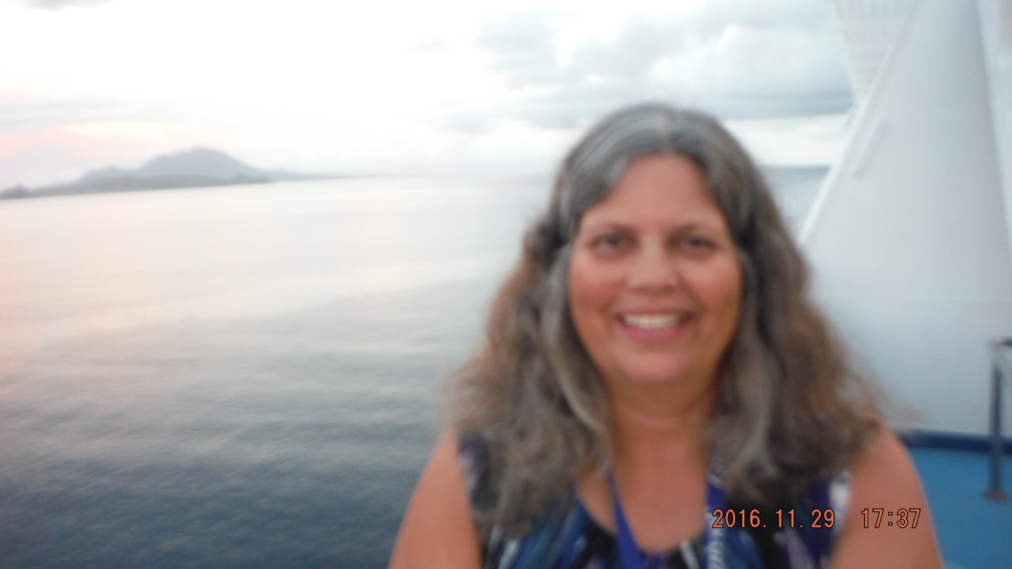A hot sexy mama selfie of me with big rock virgin islands in the background.