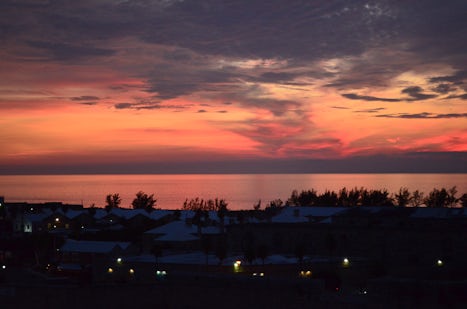 This is a photo of a sunset from the ship while in the port of Bermuda overnight!
