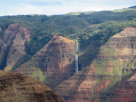 Waimea Canyon lookout with the waterfall in the background. Know as the Grand Canyon of the Pacific. On the island of Kauai