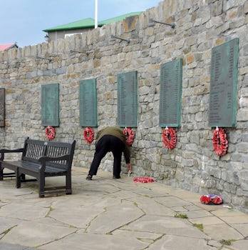 Laying a cross at the War Memorial in Port Stanley, in memory of a friend of a friend who lost their life there during the Falklands War.