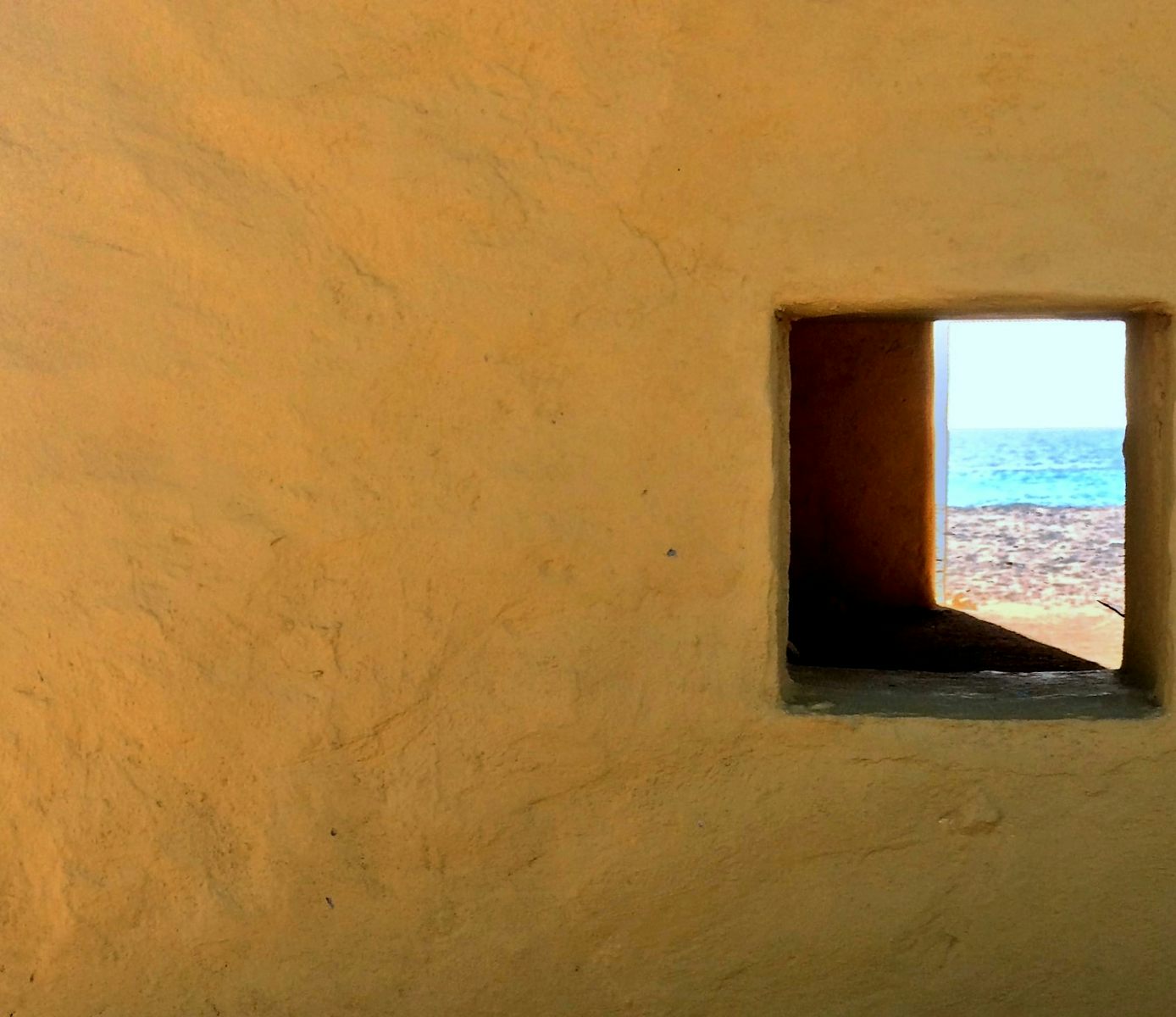 View through one of the slave huts on Bonaire.