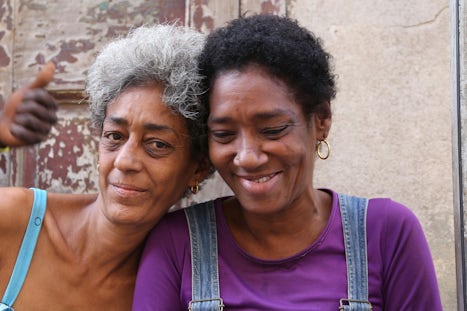 Two Cuban local ladies sitting outside of their casa