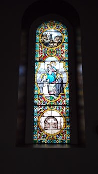 One of the stained glass windows in the Church of the Madonna.