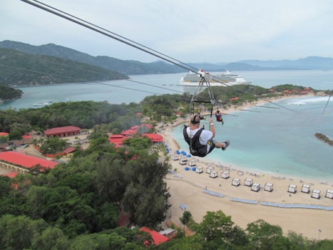 I was taking my significant others photo holding on with one hand while snapping the picture with my camera.  We zip-lined over Royal Caribbeans private beach of Haiti. After getting over the initial fear the view was amazing!!!